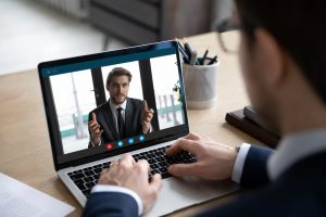 video meeting man on laptop