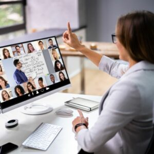 woman taking online training class with others